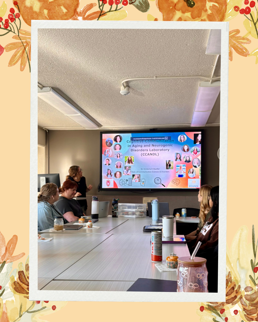 Fall background with pumpkins, leaves, red berries and pinecones Dr. Mueller presenting introducing a slide of the CCANDL lab members