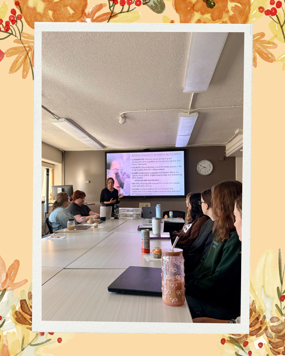 Fall background with pumpkins, leaves, red berries and pinecones Dr. Mueller presenting going over CCANDL's ongoing research projects
