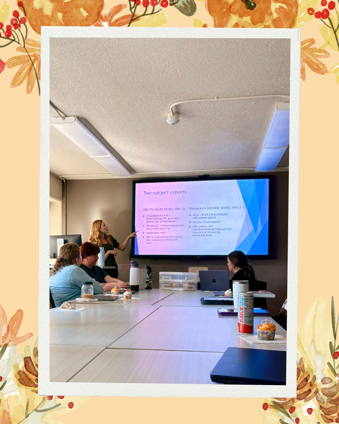 Fall background with pumpkins, leaves, red berries and pinecones Dr. Dresang going over cohorts in their current studies